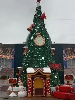 a christmas tree with a clock on top of it at Linda Apartments- Arena in Novi Beograd