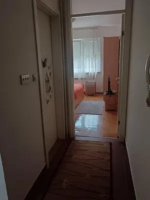 a hallway with a door leading to a bedroom at Linda Apartments- Arena in Novi Beograd