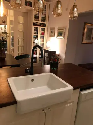 a kitchen with a white sink on a counter at Vračar Elegance Apartment in Belgrade