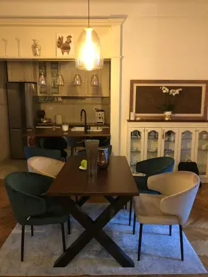 a dining room with a table and chairs at Vračar Elegance Apartment in Belgrade