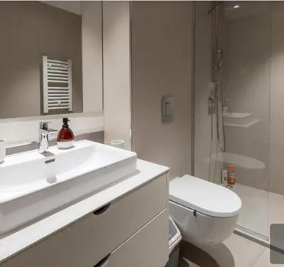a white bathroom with a sink and a toilet at Beograd na vodi - Belgrade Waterfront BW apartment in Belgrade