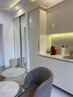 a kitchen with a glass table and two chairs at Beige Harmony in Smederevo