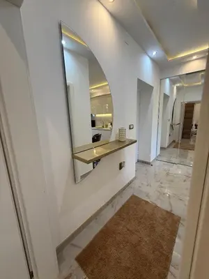 a hallway with a mirror and a sink in a room at Beige Harmony in Smederevo