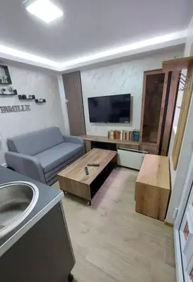 a living room with a couch and a coffee table at Radojkovic Apartman in Belgrade