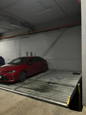 a red car parked in a parking garage at Forest Nook FREE GARAGE in Belgrade