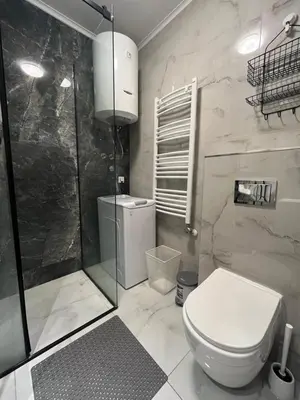 a bathroom with a toilet and a glass shower at Forest Nook FREE GARAGE in Belgrade