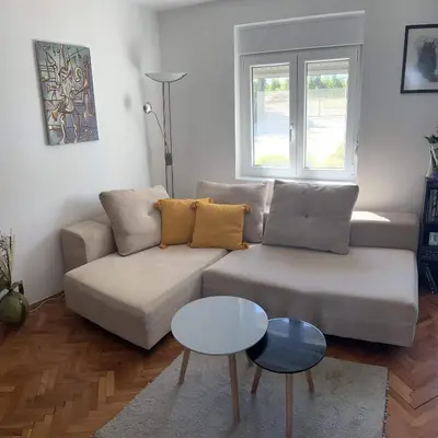 a living room with a couch and a table at Pokito House on the Hill in Sremski Karlovci