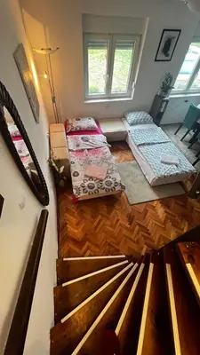 a room with four beds sitting on the floor at Pokito House on the Hill in Sremski Karlovci