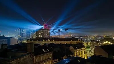 a view of a city at night with a building at Belgrade on water view apartment - City center in Belgrade
