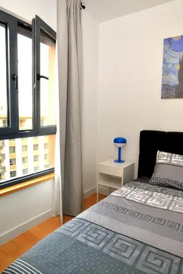 a bedroom with a bed and a window at Belgrade Waterfront Heaven! in Belgrade