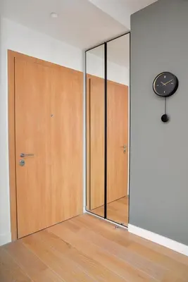 a room with a door and a clock on a wall at Belgrade Waterfront Heaven! in Belgrade