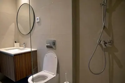 a bathroom with a shower with a toilet and a sink at Belgrade Waterfront Heaven! in Belgrade