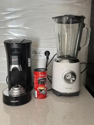 a blender on a counter next to a can of coffee at Petra in Stara Pazova