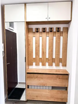 a wooden door leading into a room with a doorway at Limpio Apartman 2 in Belgrade
