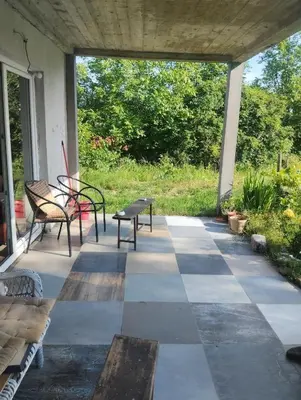 a porch with two benches and a table at Summer house in Belgrade in Slanci