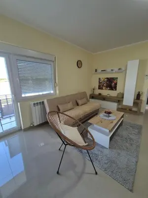 a living room with a couch and a table at Rio Apartmani Ub in Ub