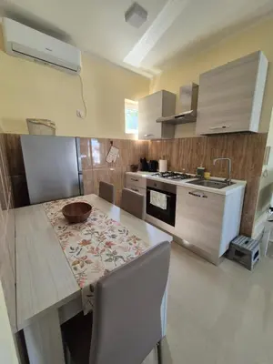 a kitchen with a table with a bowl on it at Rio Apartmani Ub in Ub