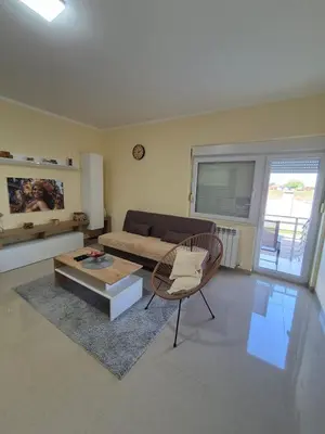 a living room with a couch and a table at Rio Apartmani Ub 2 in Ub