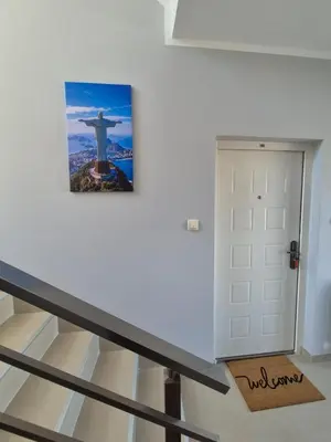 a picture of the redeemer on a wall next to a door at Rio Apartmani Ub 2 in Ub
