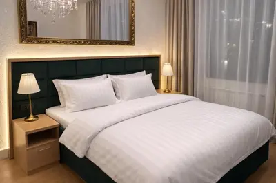 a bedroom with a large bed and a mirror at BW Loft Apartments FREE GARAGE Fast Wi-Fi in Belgrade
