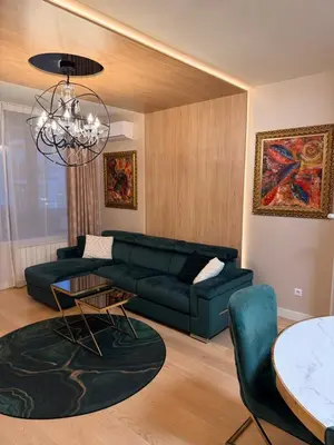 a living room with a couch and a table at BW Loft Apartments FREE GARAGE Fast Wi-Fi in Belgrade