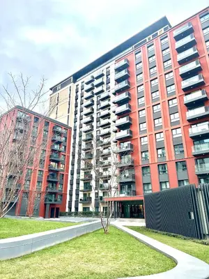 a large red building with a tree in front of it at BW Loft Apartments FREE GARAGE Fast Wi-Fi in Belgrade