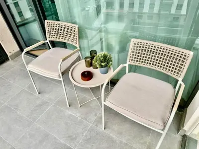 two chairs and a table with a plant on it at BW Loft Apartments FREE GARAGE Fast Wi-Fi in Belgrade
