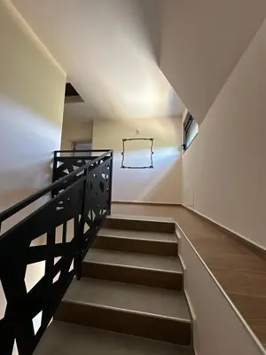 a staircase in a house with a stair railing at Vila Remeta in Velika Remeta
