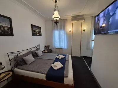 a bedroom with a bed with two towels on it at Authentic Belgrade Centre Hostel - Only Private Rooms in Belgrade