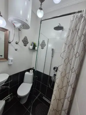a bathroom with a shower with a toilet and a sink at Authentic Belgrade Centre Hostel - Only Private Rooms in Belgrade