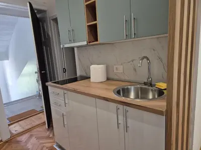 a kitchen with a sink and a counter at URBAN Suites in Belgrade