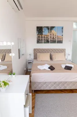 a bedroom with a large bed in a room at Apartman Horizont in Arandjelovac