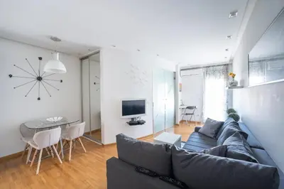 a living room with a couch and a table at Apartment Angelo in Belgrade