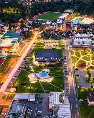 an aerial view of a city at night at Apartman Mojsilović in Ub