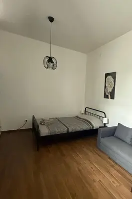 a room with a bed and a couch in it at Amar3 in Belgrade