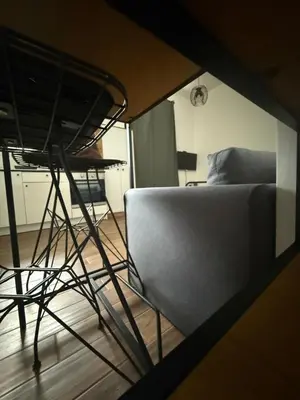 a view of a room with a couch and a chair at Amar3 in Belgrade