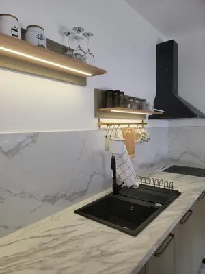 a kitchen counter with a sink in a kitchen at Park residence Apartman 2, Mirijevo, Serbia in Belgrade