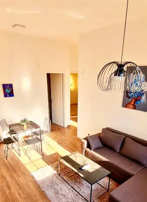 a living room with a couch and a table at Amar2 in Belgrade