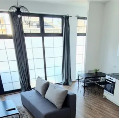 a living room with a couch and a table at Amar 1 in Belgrade