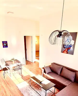 a living room with a couch and a table at Amar 2 in Belgrade
