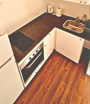 a kitchen with a sink and a stove at Amar 2 in Belgrade