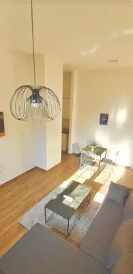 a living room with a couch and a table at Amar 2 in Belgrade