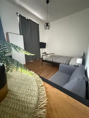 a living room with a couch and a bed at Amar 3 in Belgrade