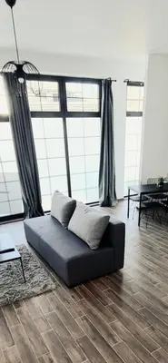 a living room with a couch and a table at Amar 1 in Belgrade