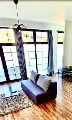 a living room with a couch and a table at Amar 1 in Belgrade