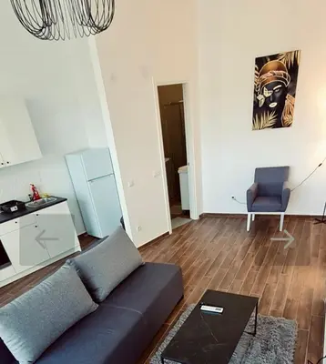 a living room with a couch and a chair at Amar 1 in Belgrade