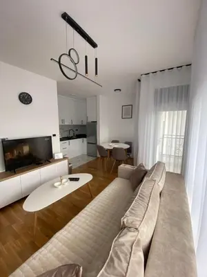 a living room with a couch and a table at Apartman P&N Stara Pazova in Stara Pazova