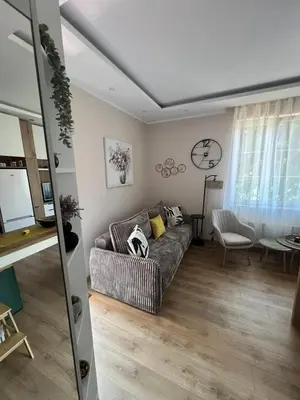 a living room with a couch and a table at Lemon Place in Belgrade