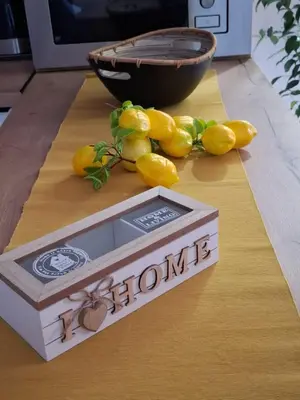 a pile of lemons on a cutting board with a box at Lemon Place in Belgrade