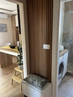 a kitchen with a washer and dryer in a room at Lemon Place in Belgrade